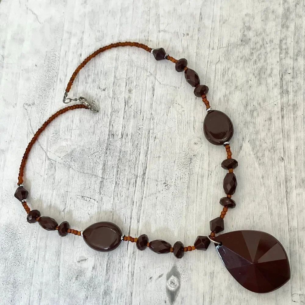 Brown plastic beaded pendant necklace